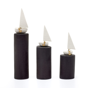 White boats on a black base charm